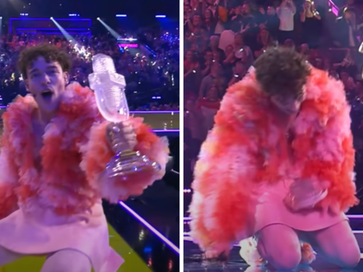 Eurovision winner Nemo holding their trophy