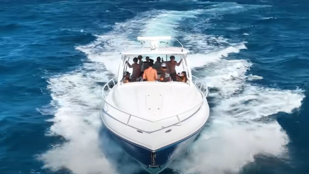 Group of teenagers seen on a boat dumping trash in the ocean off Florida