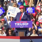 Donald Trump wears a MAGA hat as he makes a speech in New Jersey at a rally