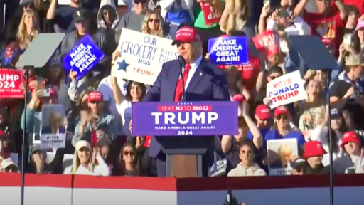 Donald Trump wears a MAGA hat as he makes a speech in New Jersey at a rally