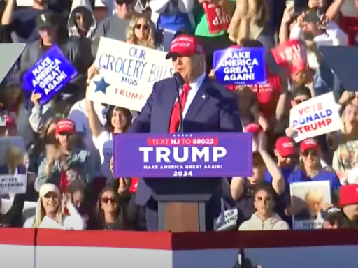 Donald Trump wears a MAGA hat as he makes a speech in New Jersey at a rally