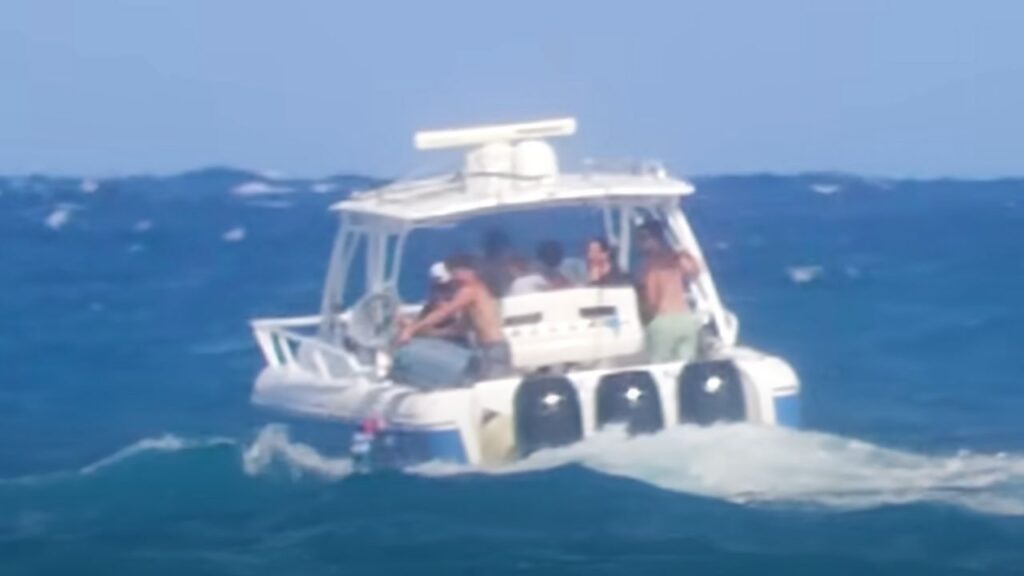 Group of teenagers seen on a boat dumping trash in the ocean off Florida