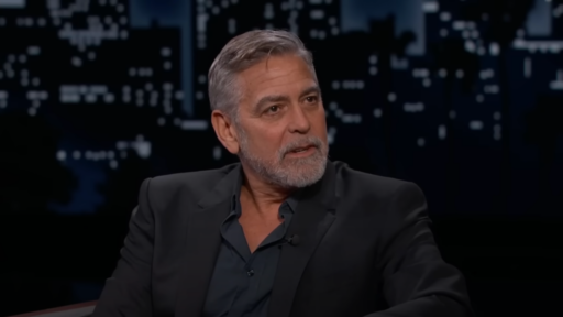 George Clooney wears a dark navy shirt and black blazer