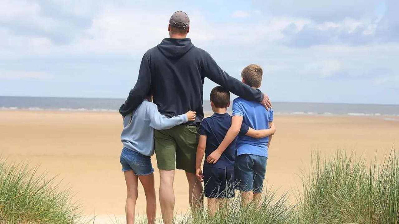 Prince William poses with his children on Father's Day at a beach in Norfolk